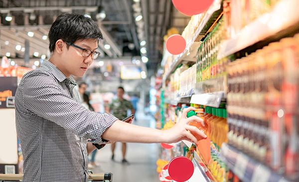 young asian man grocey shopping